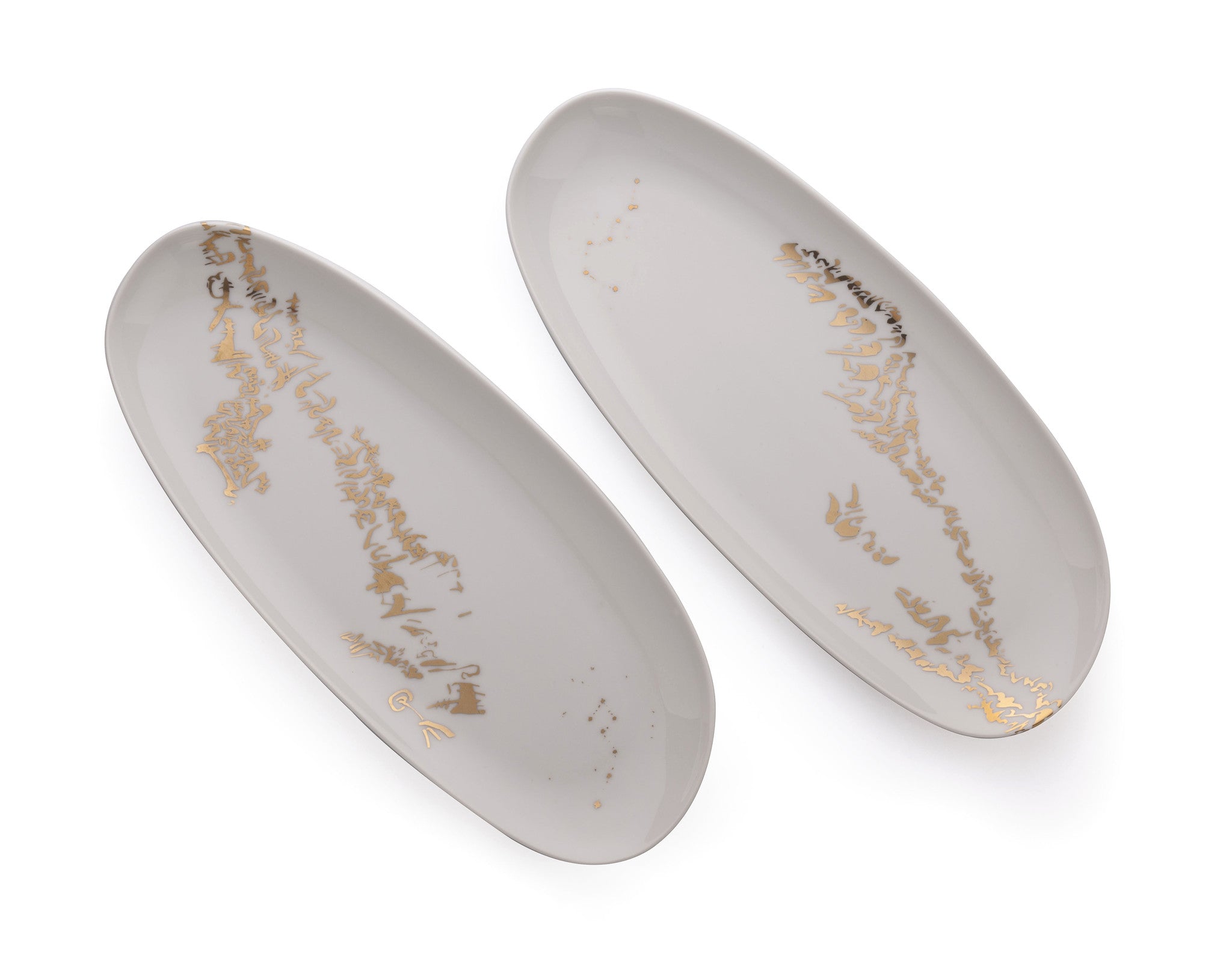 Two oval serving dishes - Enigmatic script set